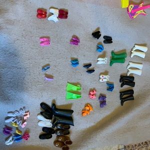 35 pairs of doll shoes mostly Barbie